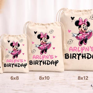 May include: Four beige drawstring bags of varying sizes, each featuring a Minnie Mouse design in pink and black. The bags are labeled with "ARLYN'S BIRTHDAY" in pink and black text. Sizes include 4x6, 6x8, 8x10, and 8x12 inches.