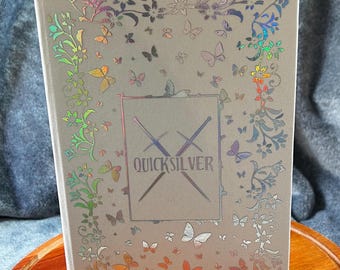 Quicksilver Book Rebind written by Callie Hart, Ivory and Reflective Silver