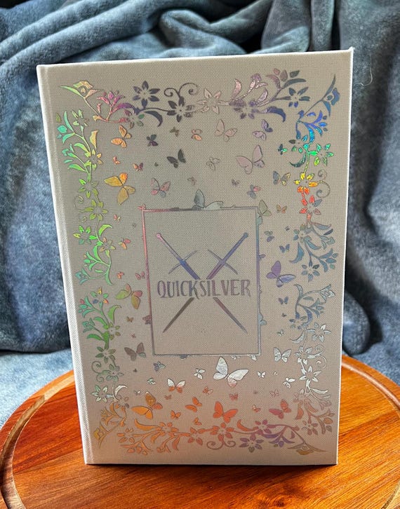 Quicksilver Book Rebind written by Callie Hart, Ivory and Reflective Silver