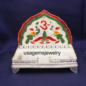 Silver Finish Singhasan with Colorful Enamel & Om Design – German Silver Bajot for Mandir God Idol
