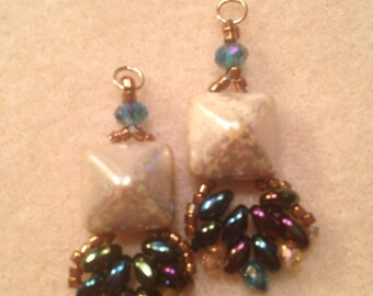 Small fan dangle earring.  1 1/2 inch long with gold filled earring wires  accented with swarovski crystals and glass beadsed