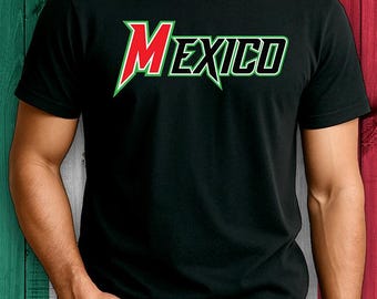 May include: Black t-shirt with the word "MEXICO" in a stylized font. The word "MEXICO" is in red and green, with a green outline. The background is a wooden surface with the colors of the Mexican flag.