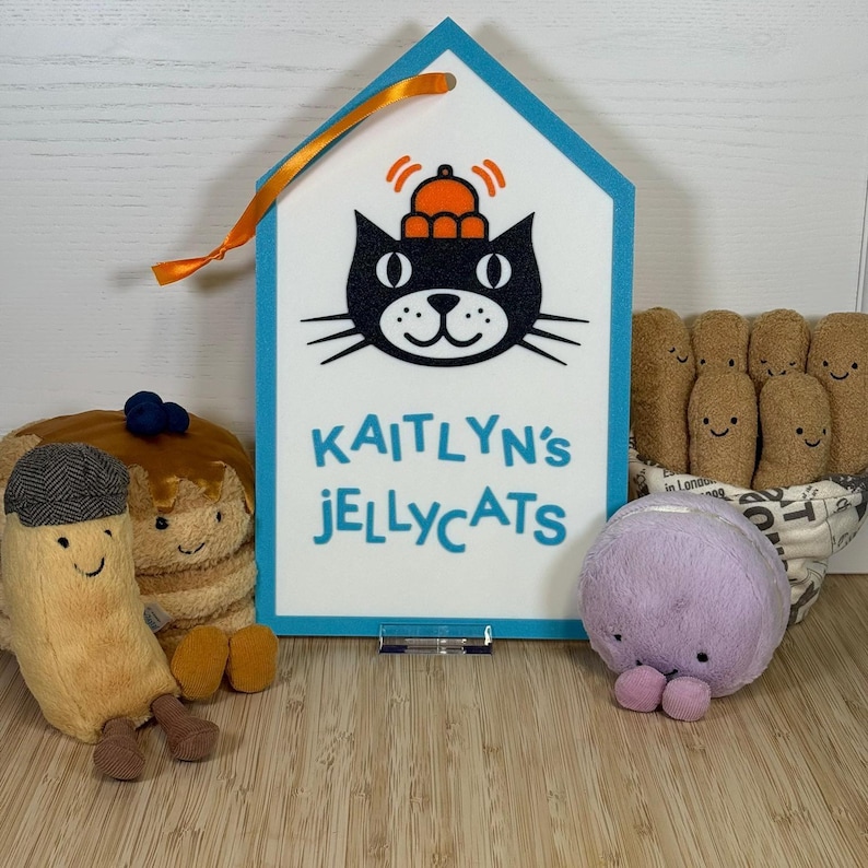 Example Jellycat tag with plush toys for scale