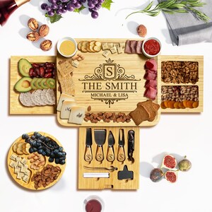 May include: A bamboo charcuterie board engraved with "The Smith", filled with snacks like cheese, crackers, fruits, and nuts. Includes cheese knives and a wine opener. The board is designed for serving food and measures approximately 40 cm.