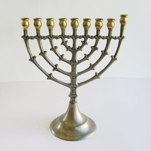 A metal  vintage  hanukkah menorah,  judaica made in Israel, good condition!