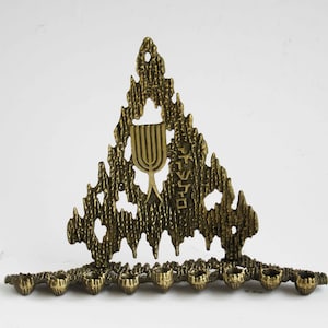 A vintage solid brass chanukah menorah by &quot;Weinberg&quot; Israel, signed.