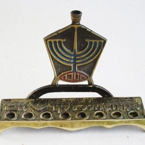 A rare and unique solid brass  vintage  hanukkah menorah, judaica made in Israel.