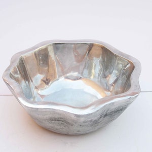 Wavy rim cast and polished aluminum fruit bowl