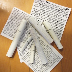 ONE used scroll (parchment) for mezuzah 16 cm long.