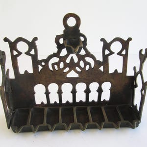 A   large solid brass  vintage  hanukkah menorah,  judaica made in Israel. replica by &quot;Erets Israel museum&quot;.