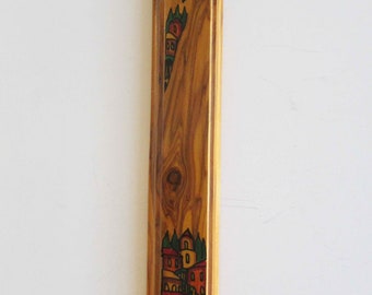 A  vintage wooden  mezuzah case that was made in Israel.