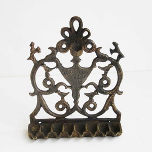 A  solid brass  vintage  hanukkah menorah,  judaica made in Israel .