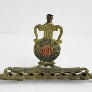 A  solid brass  vintage  hanukkah menorah,  judaica made in Israel .