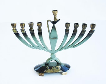 A vintage solid brass chanukah menorah