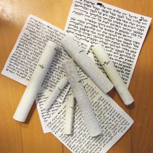 ONE used scroll (parchment) for mezuzah 12 cm long.