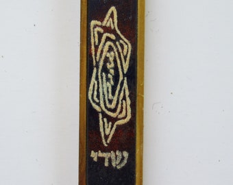 A vintage wood and enamel  mezuzah case made in Israel.