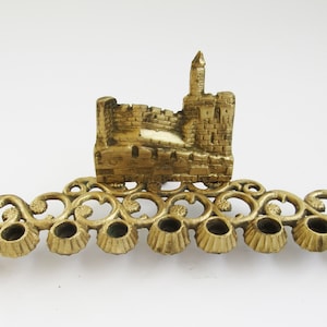 A  solid brass  vintage  hanukkah menorah,  judaica made in Israel .