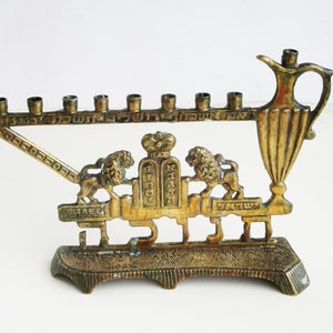 A  solid brass  vintage  hanukkah menorah, judaica made in Israel by &quot;Sabra&quot;, signed.