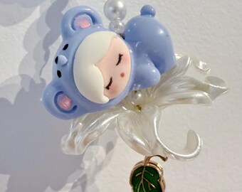 Sleepy babies on flower pearled bag charm