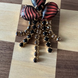 unique glass brooch with dangle rhinestones