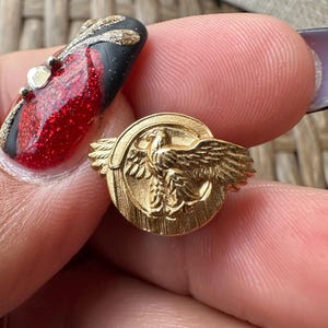 Vintage  Militaria Honorable discharge service pin in some type of  gold metal , ruptured duck- no markings