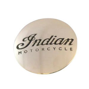 May include: A silver round emblem with the words "Indian Motorcycle" in black lettering.