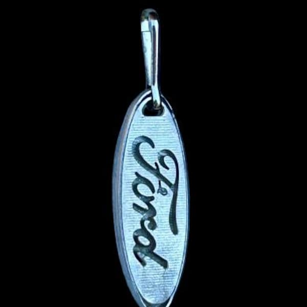 Tirador de cremallera con el logotipo de Ford