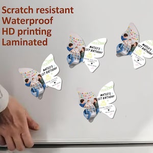 May include: Butterfly-shaped magnets with a photo of a child and the text "Mateo's 1st Birthday." The magnets are white with colourful accents and the words "Scratch resistant, Waterproof, HD printing, Laminated."