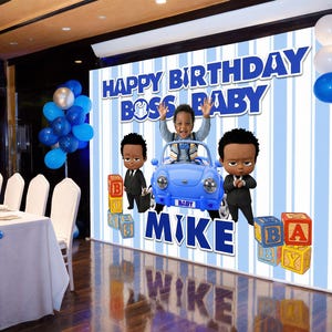 May include: A large rectangular backdrop for a birthday party featuring blue and white vertical stripes. The text reads HAPPY BIRTHDAY BOSS BABY and MIKE. It includes illustrations of a child in a blue toy car and two characters in suits.