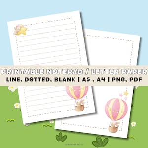 May include: Two white printable notepads with lined and blank pages. The design includes a pink and yellow hot air balloon with a bunny in a basket. The text "PRINTABLE NOTEPAD / LETTER PAPER" is visible.
