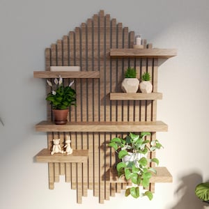 May include: A wooden wall shelf with a geometric design. The shelf has four levels and is decorated with potted plants and small figurines.