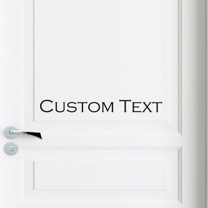 May include: White door with a black vinyl decal that says "CUSTOM TEXT".