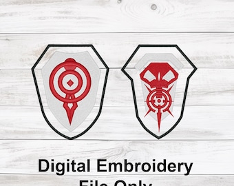 May include: Two digital embroidery files featuring shield designs. One shield has a red circular and diamond design, the other has a red skull-like design. Both are on a white background with a black border. Text at the bottom reads "Digital Embroidery File Only."