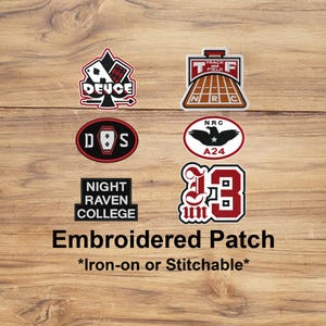 May include: A collection of embroidered patches with various designs, including a playing card, track and field, and college emblems. The patches are in red, black, and white, with text such as "DEUCE" and "NIGHT RAVEN COLLEGE". The text "Embroidered Patch" is also visible.
