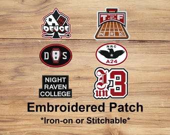 May include: A collection of embroidered patches with various designs, including a playing card, track and field, and college emblems. The patches are in red, black, and white, with text such as "DEUCE" and "NIGHT RAVEN COLLEGE". The text "Embroidered Patch" is also visible.