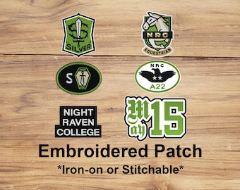 May include: A collection of embroidered patches with various designs and text, including "SILVER", "NRC EQUESTRIAN", "NIGHT RAVEN COLLEGE", and "May 15". The patches are in green, black, and white, with an iron-on or stitchable backing.