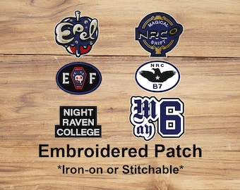 May include: A collection of embroidered patches with various designs and text. The patches include a stylized apple, a circular design with "MAGICAL NRC SHIFT", an oval with "E F", and a rectangular patch that says "NIGHT RAVEN COLLEGE".