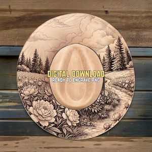 May include: A beige cowboy hat with a detailed landscape design. The hat features a central beige crown and a wide brim with a black and white illustration of a field of flowers, trees, and a path. Text on the hat reads "DIGITAL DOWNLOAD READY TO ENGRAVE PNG."