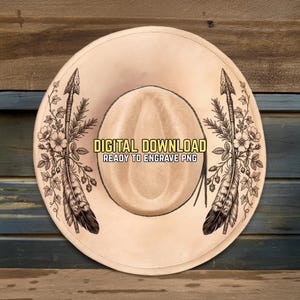 May include: A tan cowboy hat with a decorative design. The hat features two arrows with floral and feather accents. The text "DIGITAL DOWNLOAD READY TO ENGRAVE PNG" is displayed on the hat.