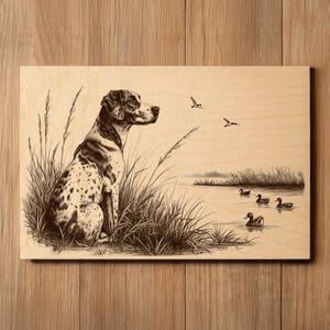 May include: A sepia-toned wooden plaque featuring a detailed illustration of a hunting dog sitting in tall grass, observing ducks on a lake. Two birds fly overhead. The artwork has a vintage, rustic aesthetic.