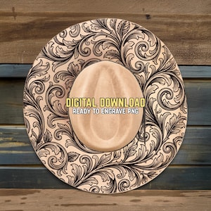May include: A light brown cowboy hat with an intricate black floral design around the brim. The hat features the text "DIGITAL DOWNLOAD READY TO ENGRAVE PNG". The hat is set against a wooden background.