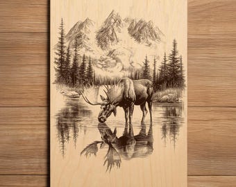 May include: A wood panel featuring an engraved image of a moose drinking from a lake. The artwork includes a mountain range, trees, and the moose's reflection in the water. The image is in shades of brown and tan.