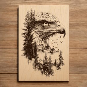 May include: Wooden wall art with a detailed illustration of an eagle's head, mountains, and pine trees. The artwork is in brown and black, with a flock of birds in flight. The background is a light wood grain. The piece is suitable for home decor.
