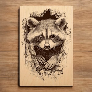 May include: A wooden plaque with a detailed illustration of a raccoon peeking from a tree hollow. The raccoon is depicted in brown and black tones, with emphasis on its eyes and paws. The artwork is set against a light wood grain background.