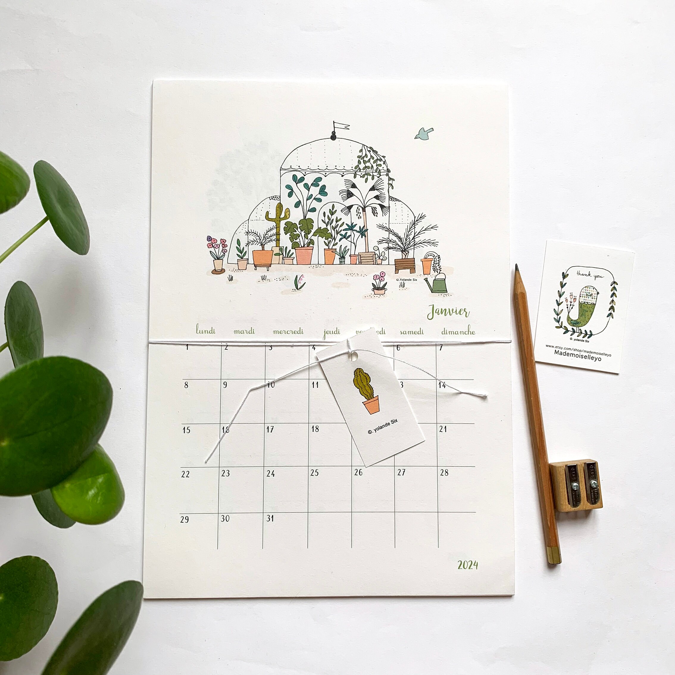 Plantilla de calendario lunar 2024 dibujada a mano con hojas y vegetación