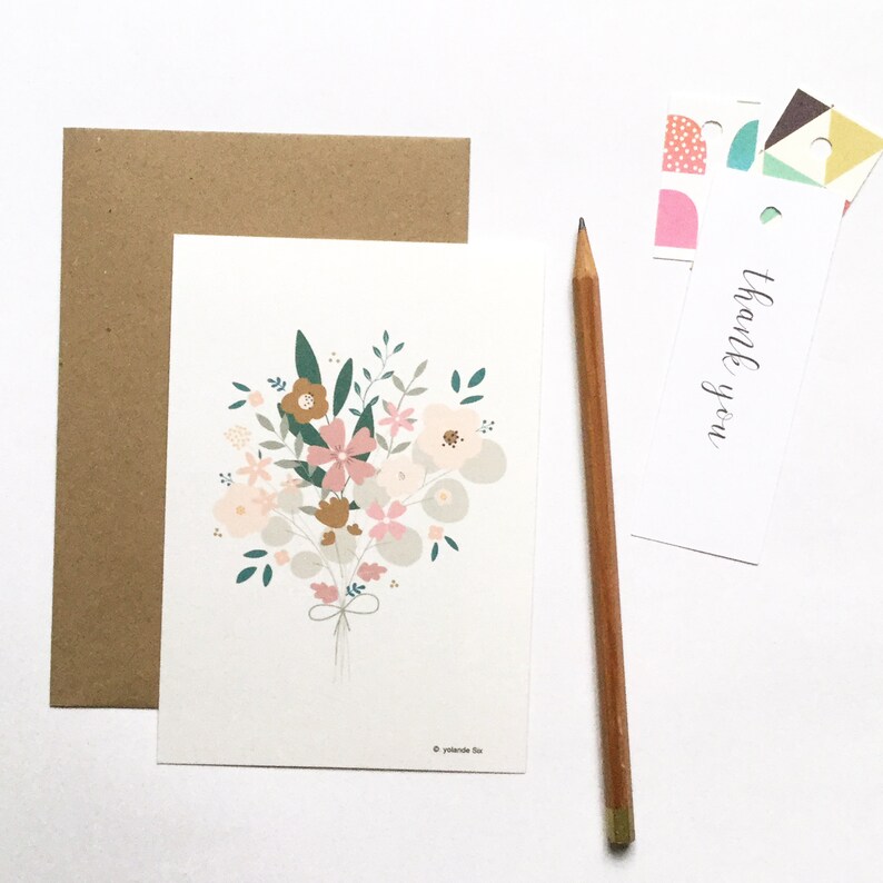 May include: A white card with a bouquet of pink, brown, and green flowers. The card has the text "thank you" on it.