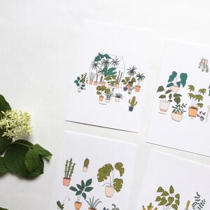 May include: Set of four printable art prints featuring illustrations of potted plants. The prints feature a variety of plants, including ferns, succulents, and cacti. The prints are in a minimalist style with black outlines and muted colors.