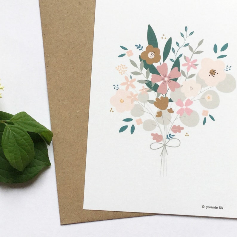 May include: A bouquet of pink, brown, and gray flowers with green leaves and a gray ribbon tied around the stems. The flowers are arranged in a loose, natural style.