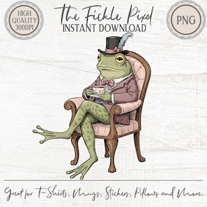 May include: A whimsical illustration of a frog in a suit and top hat, seated in a vintage armchair, holding a teacup. The frog is green with yellow eyes and a pink bow tie. Text reads "The Fickle Pixel" and "Instant Download". The image is suitable for t-shirts, mugs, stickers, and pillows.