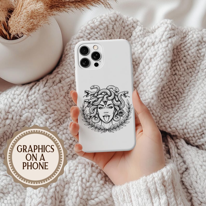 May include: White phone case featuring a black and white illustration of Medusa with snakes for hair, sticking out her tongue. The case is held in a hand against a soft, textured background. The text "GRAPHICS ON A PHONE" is in a circular logo.
